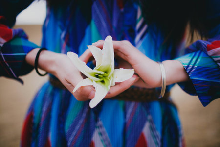 Women holding a lilium