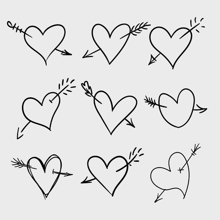 Set of hand drawn doodle hearts with arrows. Valentine's day design elements. Hand written greetings.のイラスト素材