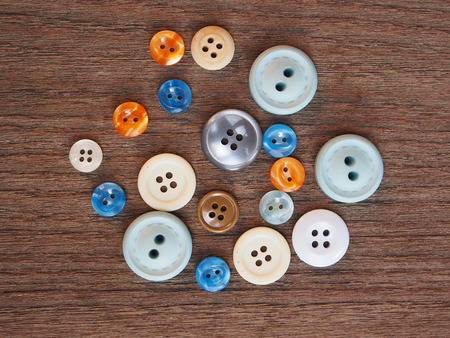 Group of buttons on the wooden table