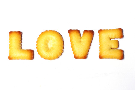 Love text made of cookies isolated on white backgroundの写真素材