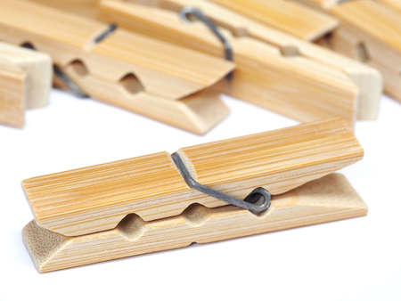 Wooden clothes pin isolated on white backgroundの写真素材