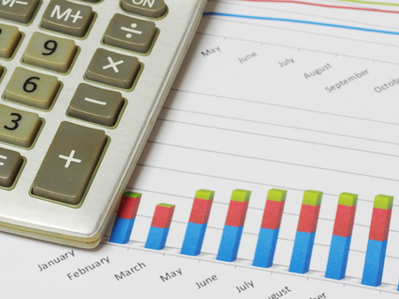 Business chart and a calculatorの写真素材
