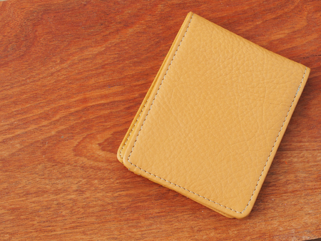 wallet leather on wooden backgroundの写真素材