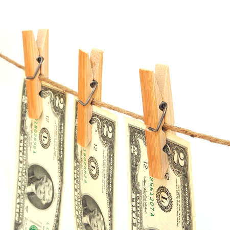 Close up of two dollar bill fixed on clothes peg isolate on white background.