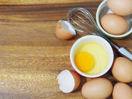 organic fresh eggs on wooden backgroundの写真素材