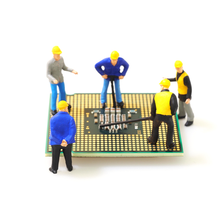 Group of engineer workers are repairing CPU (Central Processing Unit) on mainboard isolated on whute background.の写真素材