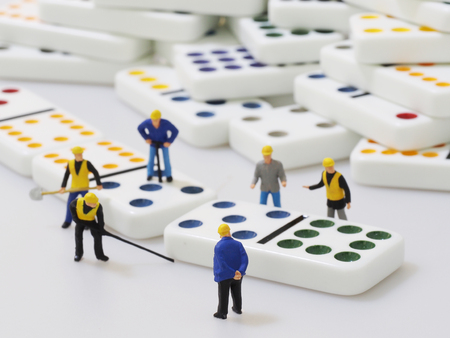 Group of engineer workers are making dominosの写真素材