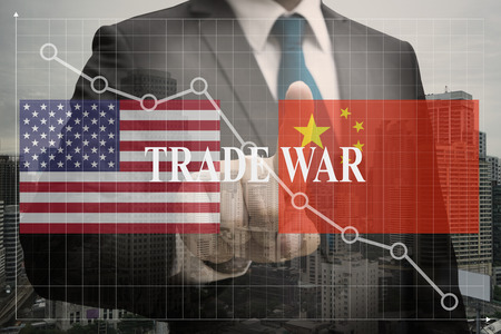 Double exposure of Businessman , trade war between the biggest economies, us and china make the world be economic crisis conceptの写真素材