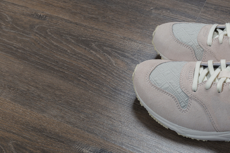 sport shoes on gray floor at home. Lifestyle concept.の写真素材