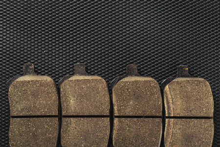 A set of new automobile brake pads on a black backgroundの写真素材