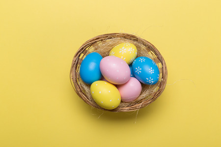 easter eggs on yellow pastel color background with space. Concept