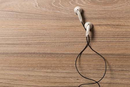 headphones and on rustic wooden table. Top viewの写真素材