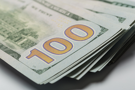 American dollars or US dollars : Asian women hand counting one hundred American money or 100 USD domination note.の写真素材