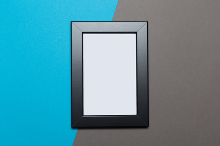 Picture frame and photo gallery on the blue background.top view
