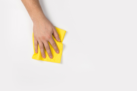 Man's or woman's hand cleaning on a white backgroundの写真素材