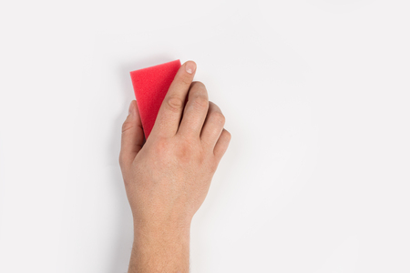 Man's or woman's hand cleaning on a white backgroundの写真素材