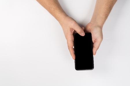 Woman hands with wall cell phone, mock upの写真素材