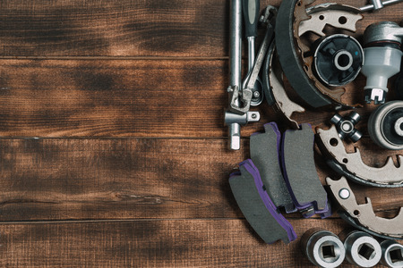 Various car parts on wooden backgroundの写真素材