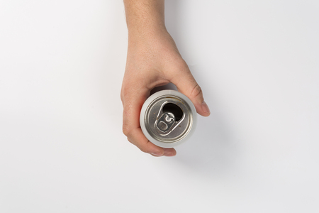 Man holding aluminum can isolated on white backgroundの写真素材