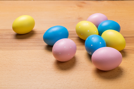 Easter eggs on wooden table. Holiday backgroundの写真素材