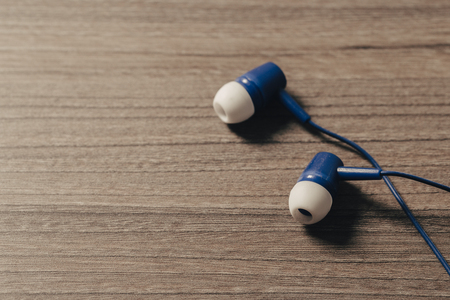 headphones and on rustic wooden table. Top viewの写真素材