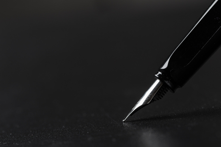 Fountain pen with black backgroundの写真素材