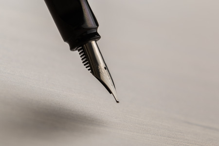 Black fountain pen on tableの写真素材