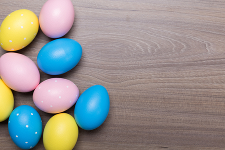 Easter eggs on wooden table. Holiday backgroundの写真素材