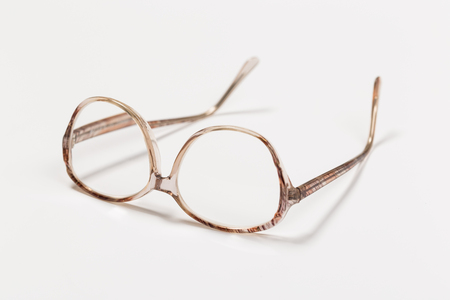 Front view of reading glasses with tortoiseshell frames on white backgroundの写真素材