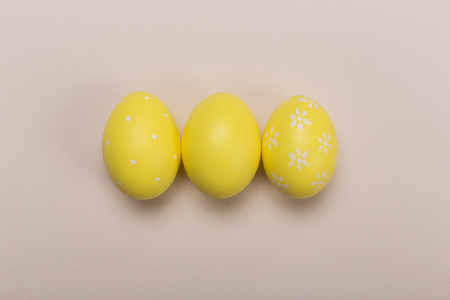 Colorfull easter eggs in nest on pastel color background with space. Conceptの写真素材