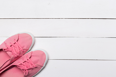pink sneakers on light white background. Women's shoes.の写真素材