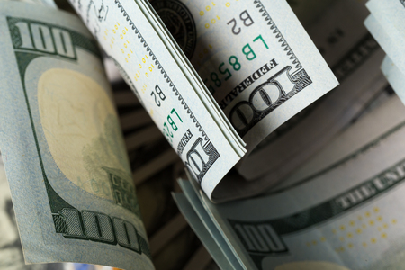 American dollars. A stack of hundred dollar bills. Close up of new hundred dollar bill on the white background.の写真素材