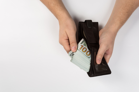 Man holding a wallet isolated on white backgroundの写真素材