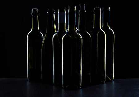 Template concept many wine bottle for your design and advertising company promotion your of product on black background with copy space. Wine bottle mockup.の写真素材