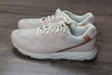 sport shoes on gray floor at home. Lifestyle concept.の写真素材