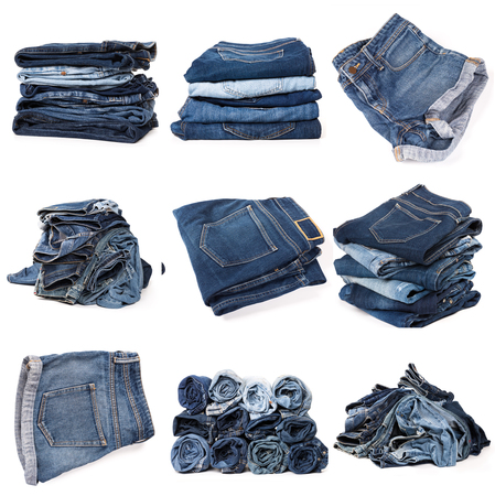 Collection of folded jeans isolated on white backgroundの写真素材