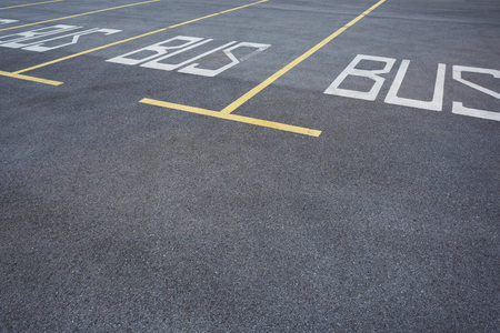 The parking stalls in a parking lot, marked with yellow lines.の写真素材