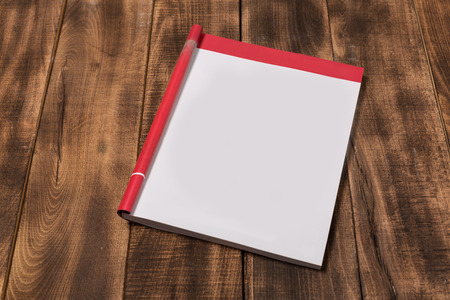 Mock-up magazine or catalog on wooden table. Blank page or notepad on wood background. Blank page or notepad for mockups or simulationsの写真素材