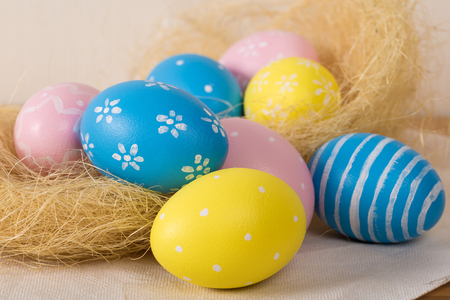 Easter eggs with colored eggs in nest. Easter holiday concept.の写真素材