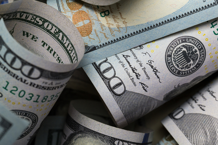 American dollars. A stack of hundred dollar bills. Close up of new hundred dollar bill on the white background.の写真素材