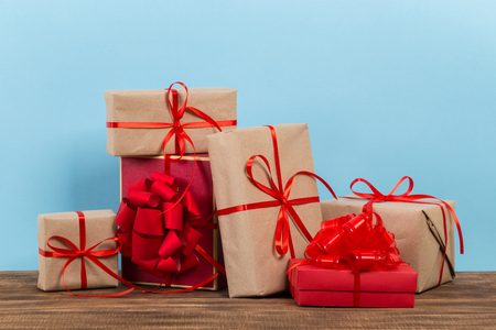 Festive gift box on blue background. Festive greeting card.の写真素材