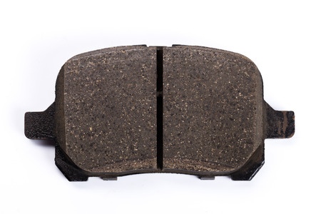 Set of old brake pads, car spares isolated on white backgroundの写真素材