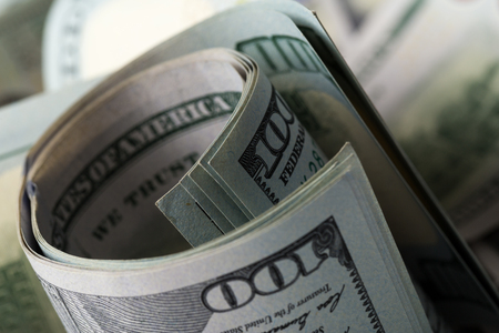 American dollars. A stack of hundred dollar bills. Close up of new hundred dollar bill on the white background.の写真素材