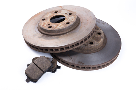 Brake pads and brake discs on white background. Auto partsの写真素材