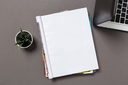 office desk top view with blank notebook  isolated on gray, changeable background. Blank page or notepad on wood background. Blank page or notepad for mockups or simulations.の写真素材