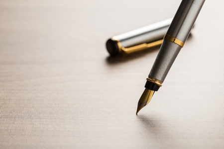 fountain pen on wooden tableの写真素材