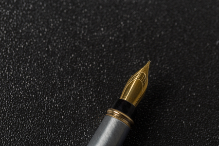 Fountain pen  on black backgroundの写真素材