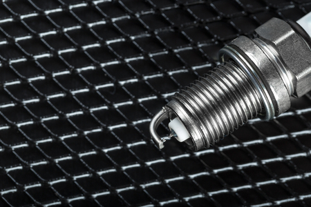 Spark plugs on black background, shallow depth of fieldの写真素材