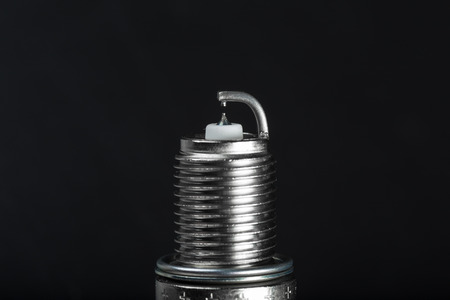 Spark plugs on black background, shallow depth of fieldの写真素材