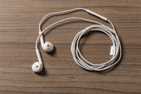 headphones and on rustic wooden table. Top viewの写真素材